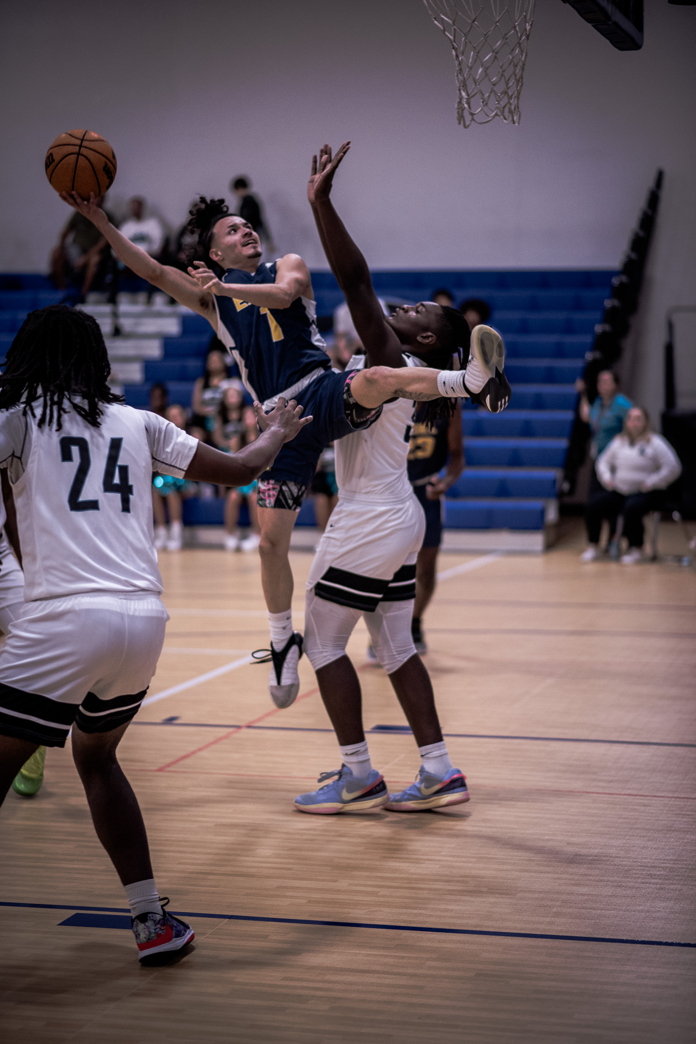 Basketball layup through defenders