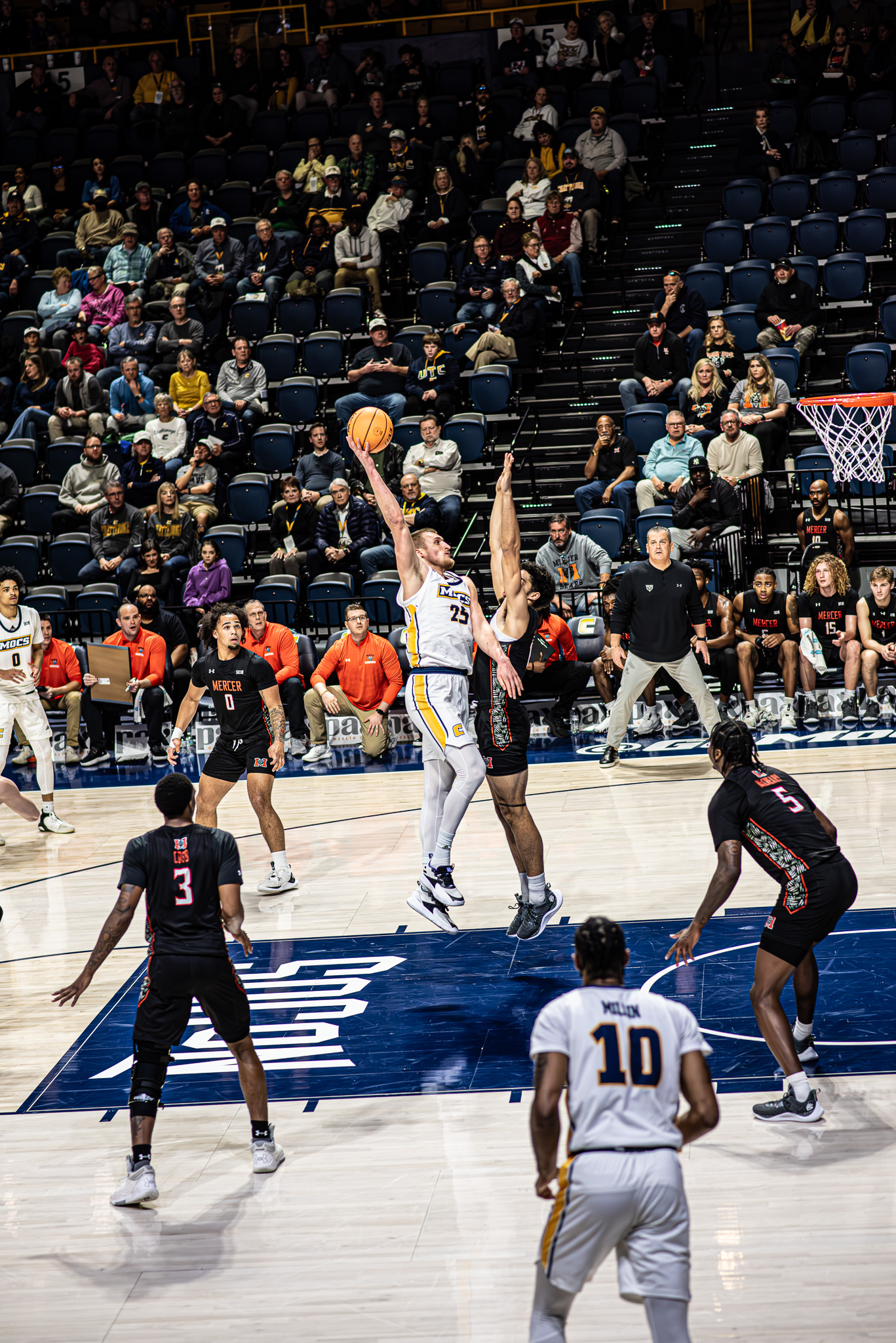 College basketball action under the hoop